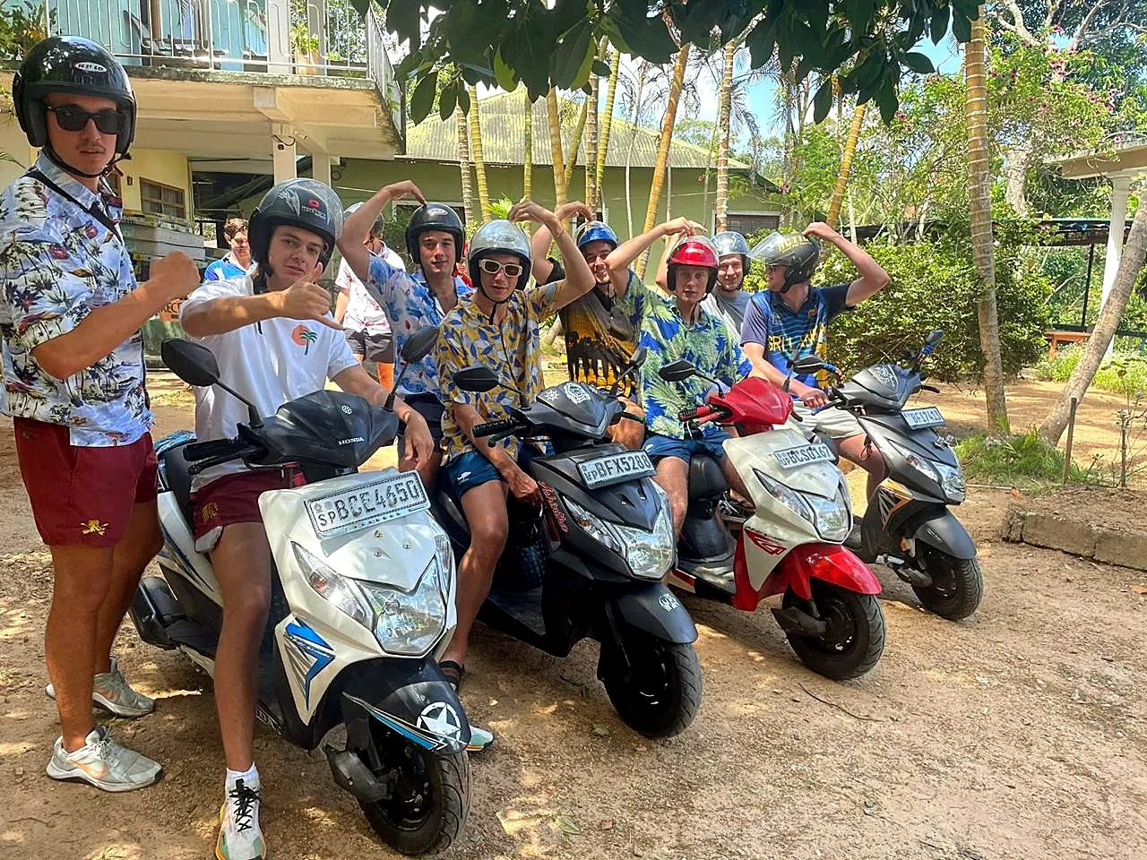 Guests heading out on a scooter day tour